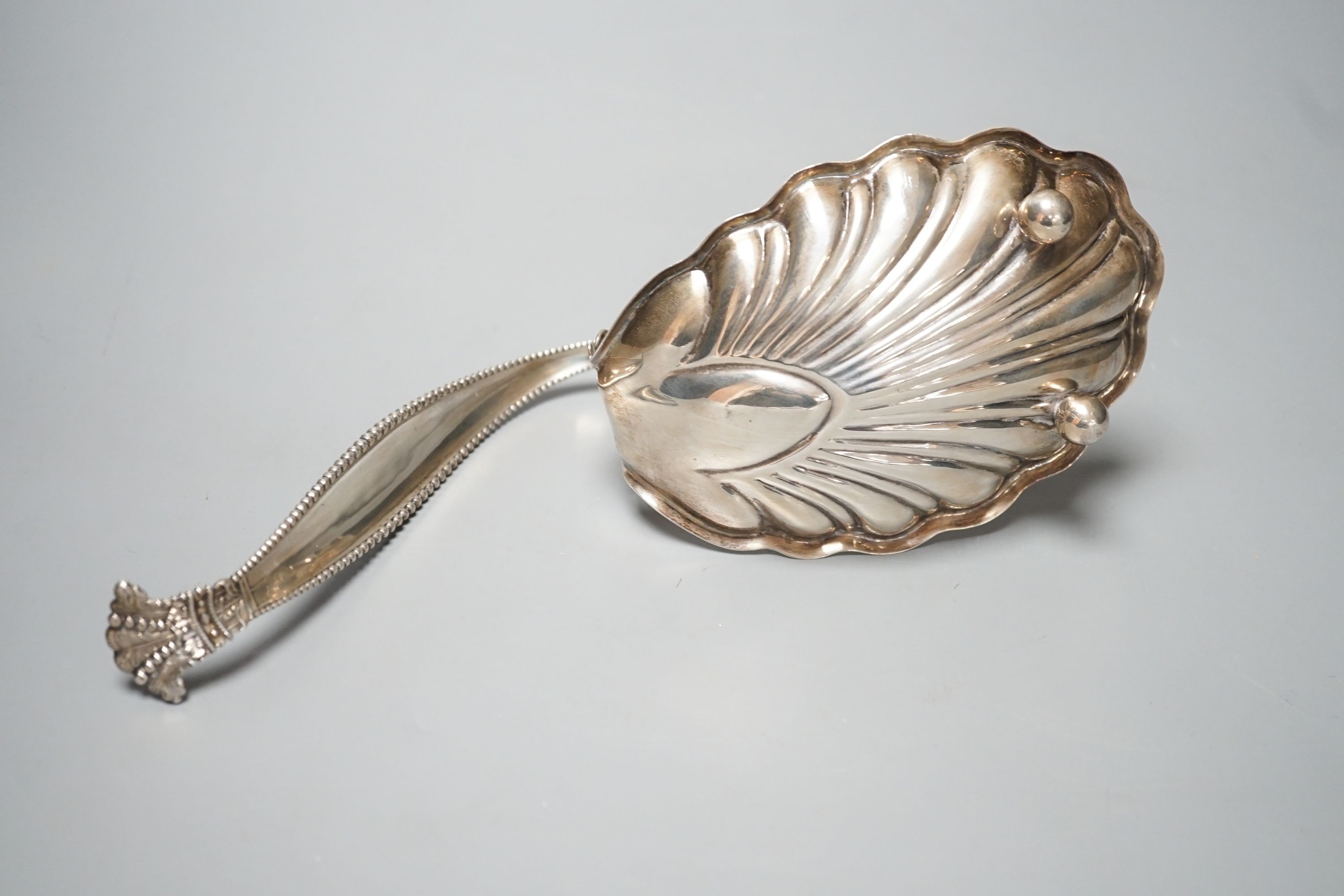 A sterling spoon shaped shell dish, by George W Schleiber & Co, 26.5cm, 6oz.